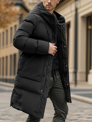 Man wearing a black puffer coat in an urban setting