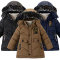 Three winter jackets in black, brown, and blue with fur-lined hoods on a white background.