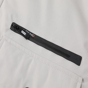 Close-up of a black belt with a brand logo on a light gray background