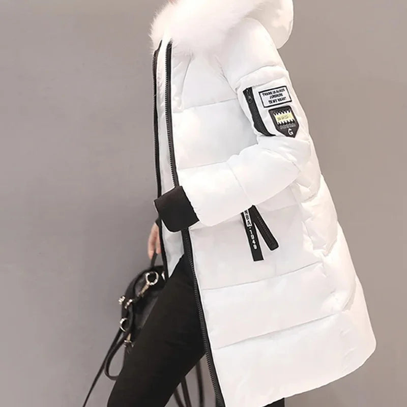 White puffer vest with black accents on a plain background