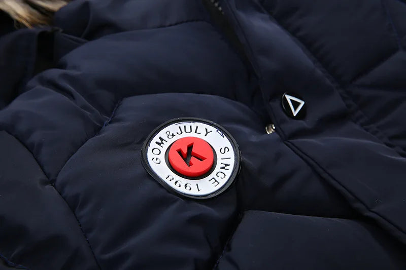 Navy blue jacket with a brand logo on a dark background