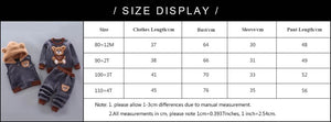Children's clothing set with size chart on a black background
