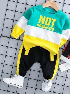 Children's outfit with 'NOT INTERESTED' text on a checkered background