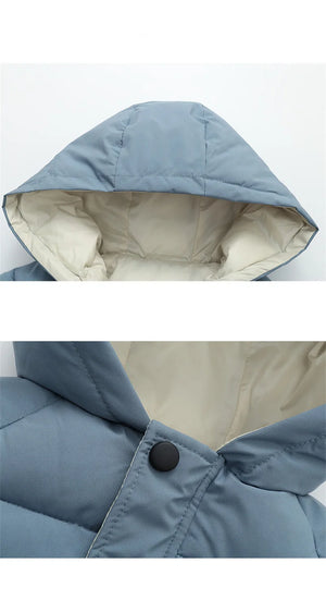 Close-up of a blue hooded jacket with beige interior lining on a white background