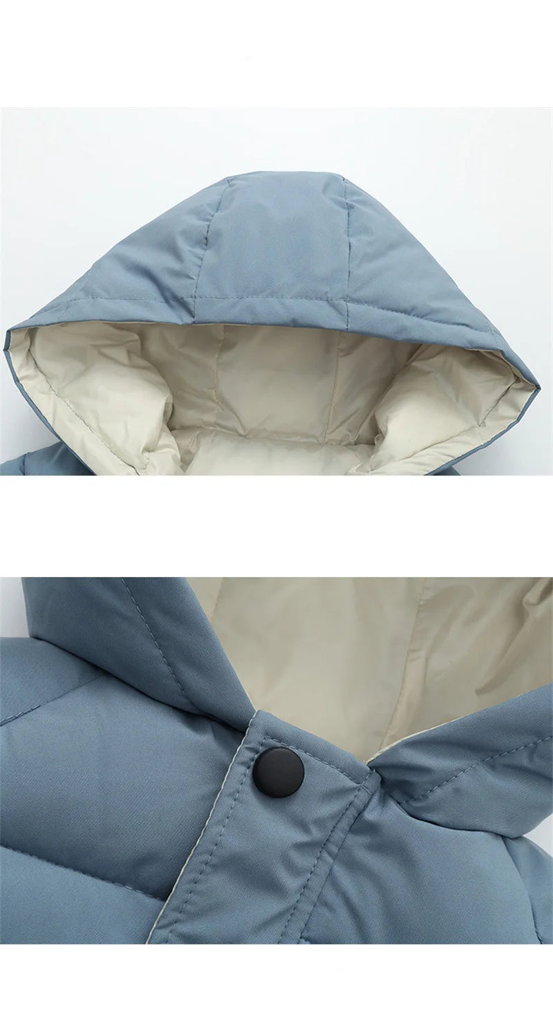 Close-up of a blue hooded jacket with beige interior lining on a white background