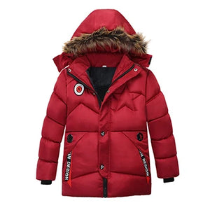 Red puffer jacket with fur-lined hood on a white background