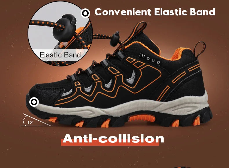 Black and orange sneaker with elastic band feature on a brown background
