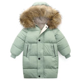 Green puffer jacket with fur-lined hood on a white background