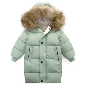 Green puffer jacket with fur-lined hood on a white background