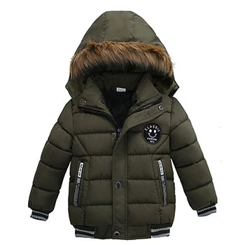 Green children's puffer jacket with fur-lined hood on a white background