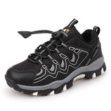 Black hiking shoe with gray accents on a white background