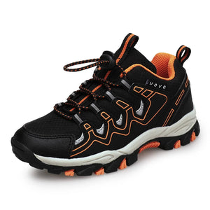 Black and orange sneaker with branding on a white background