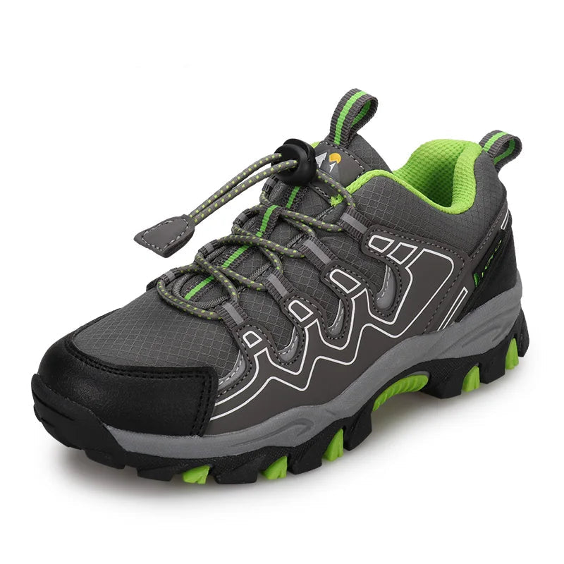 Gray and green hiking shoe with branding on a white background