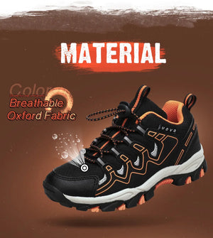 Black and orange sneaker with breathable fabric text on a brown background