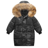 Black camouflage winter coat with brown fur hood on a white background