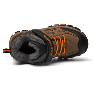 Brown children's boot with gray fur lining and orange laces on a white background