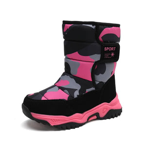 Pink and black camouflage snow boot on a white background