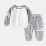 Children's gray and white sweatshirt and pants set on a white background