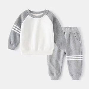 Children's gray and white sweatshirt and pants set on a white background