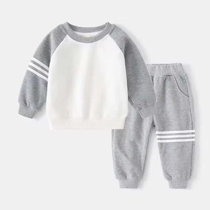 Children's gray and white sweatshirt and pants set on a white background