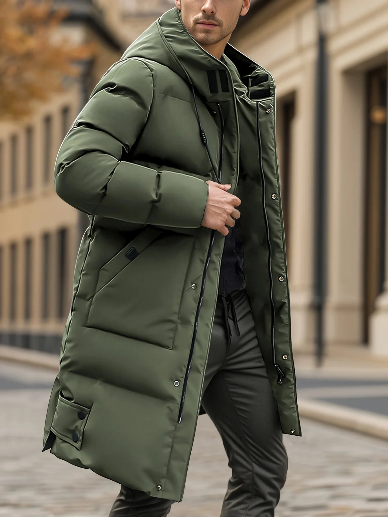 Man wearing a green puffer coat on a city street