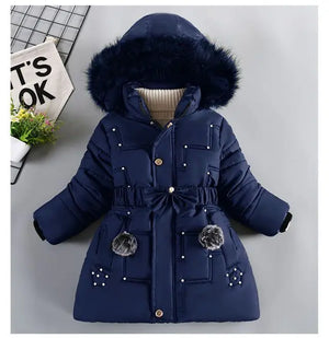 Navy blue children's winter coat with fur hood on a light gray background