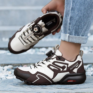 White and brown outdoor shoes being worn with a blurred background
