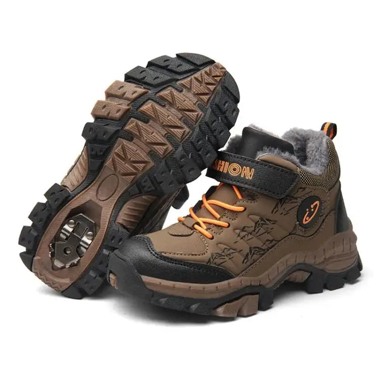 Brown children's hiking boots with orange laces on a white background