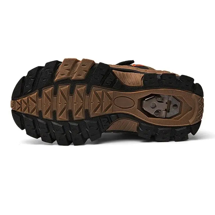 Close-up of a sandal with brown and black sole on a white background