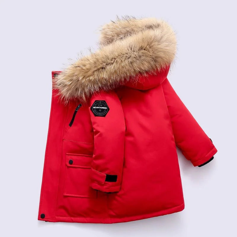 Red children's parka with fur hood on a light gray background