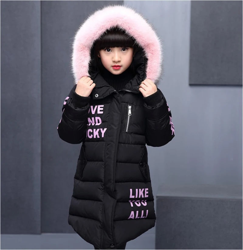 Black puffer jacket with pink fur hood and text on a gray background