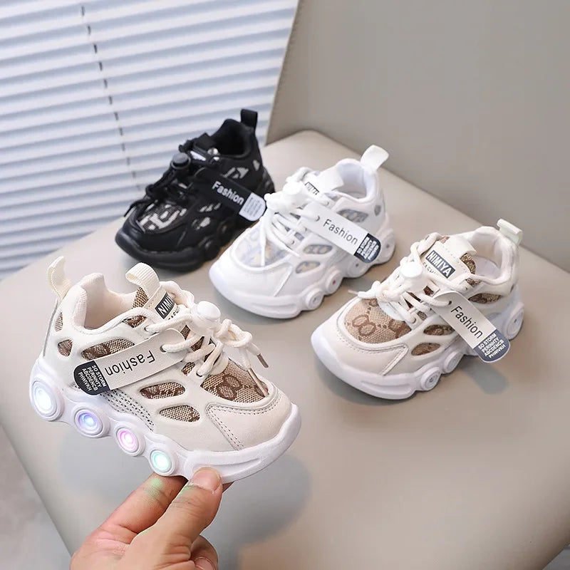 Children's LED sneakers on a light surface with a neutral background