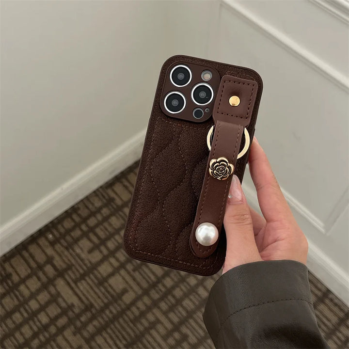 Luxury PU Leather Down Jacket Phone Case with Flower Wrist Strap for iPhone 15 Pro Max