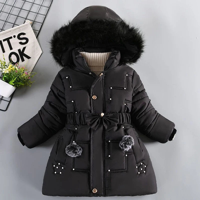 Black winter coat with fur hood on a light gray background