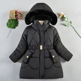 Black quilted winter coat with fur hood on a light gray background