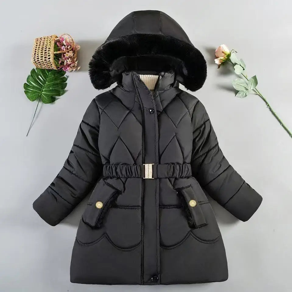 Black quilted winter coat with fur hood on a light gray background