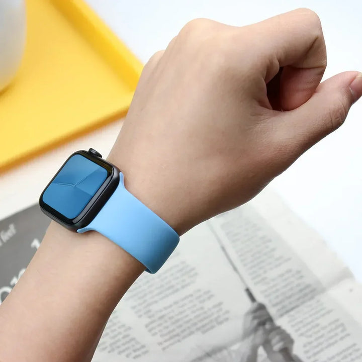 Silicone sport band for Apple Watch, compatible with Series 9/8/7/6/5/SE/Ultra, shown in vibrant colors.
