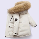 White winter coat with fur hood on a light gray background