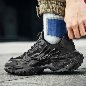 Person wearing black sneakers with a blurred background