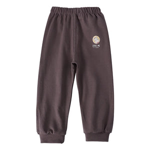 Brown sweatpants with a logo on a white background