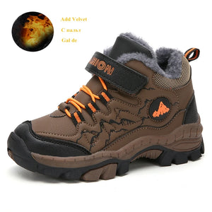 Brown children's winter shoe with orange laces on a white background