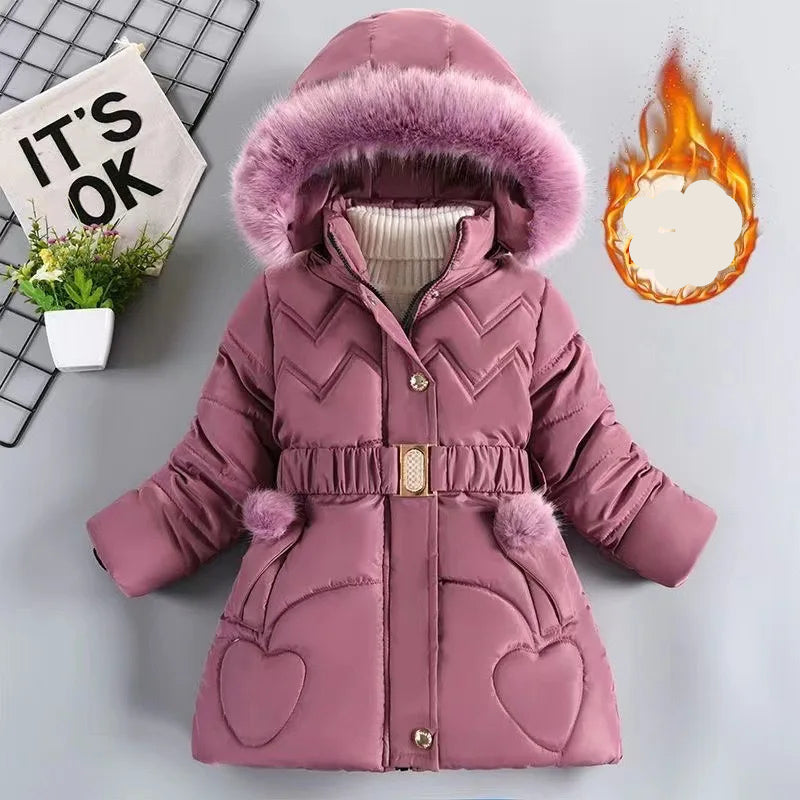 Pink children's winter coat with fur hood on a light gray background