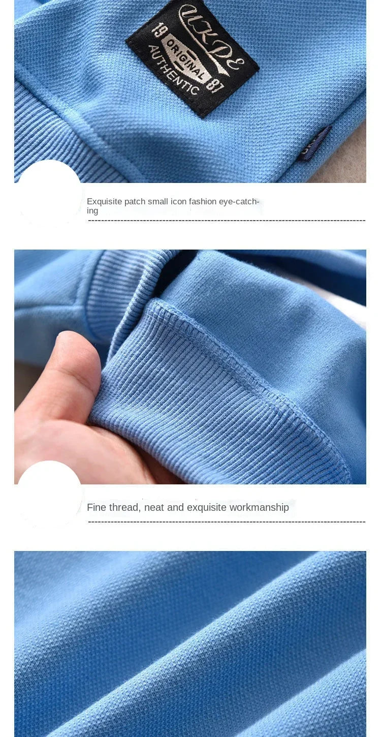 Close-up of a blue sweater with a brand label and fabric texture.