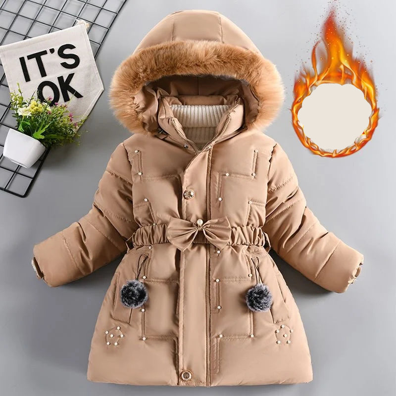 Beige winter coat with fur hood on a gray background