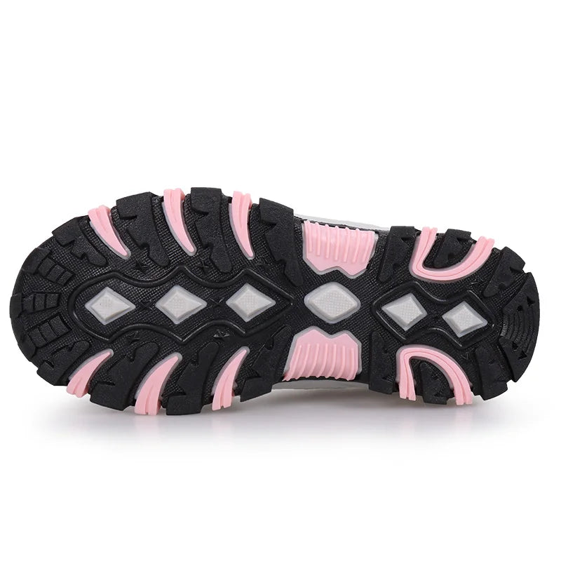 Black and pink sole of a shoe on a white background