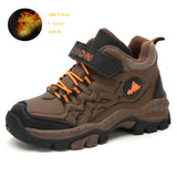 Brown children's hiking shoe with orange laces on a white background