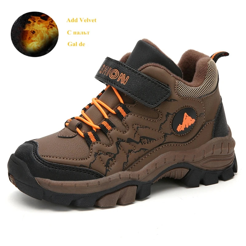 Brown children's hiking shoe with orange laces on a white background