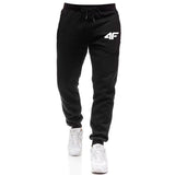 Black jogger pants with a logo on a white background