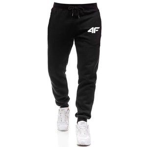 Black jogger pants with a logo on a white background