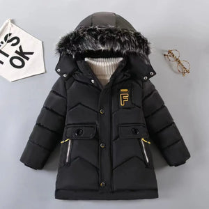 Black winter jacket with fur hood on a gray background